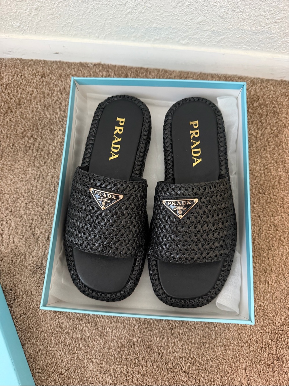 Prada Black Woven Slide Mules with Gold Logo Plaque